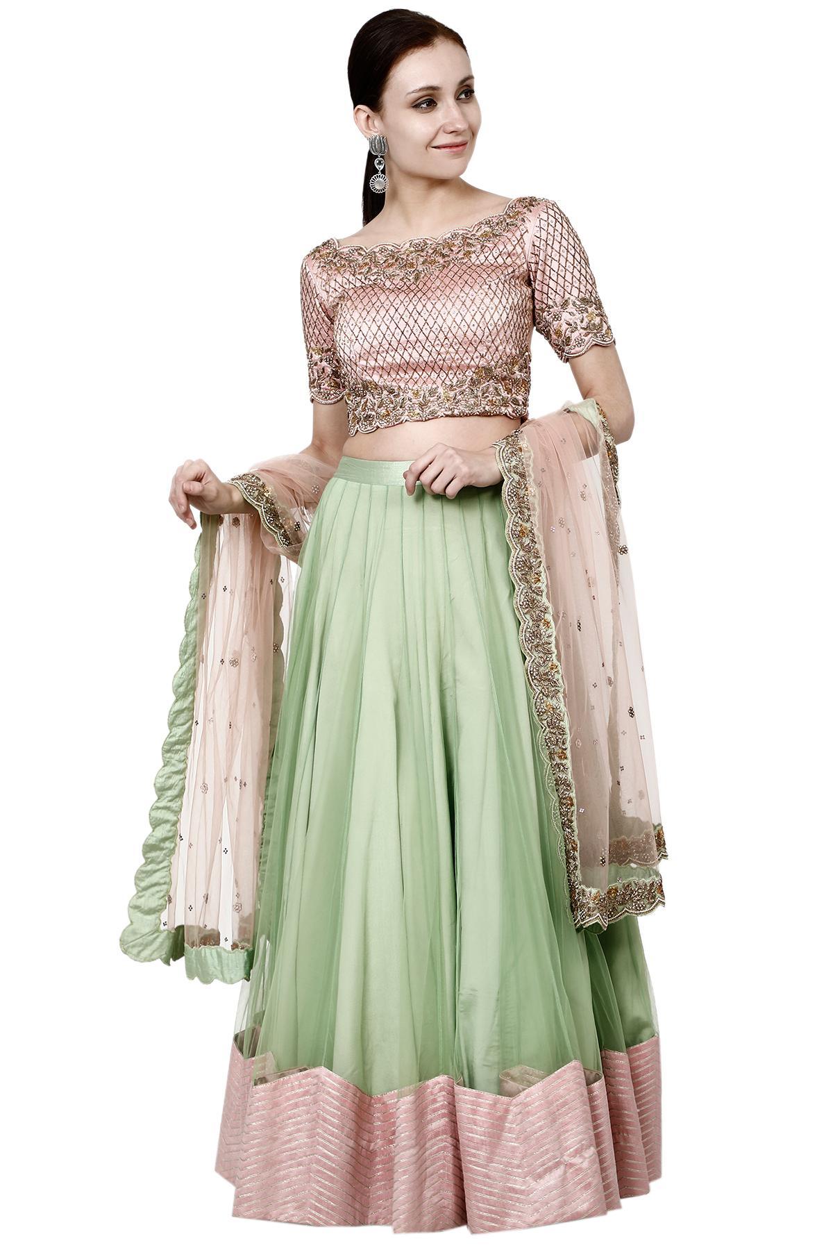 Photo of Dark green and peach lehenga