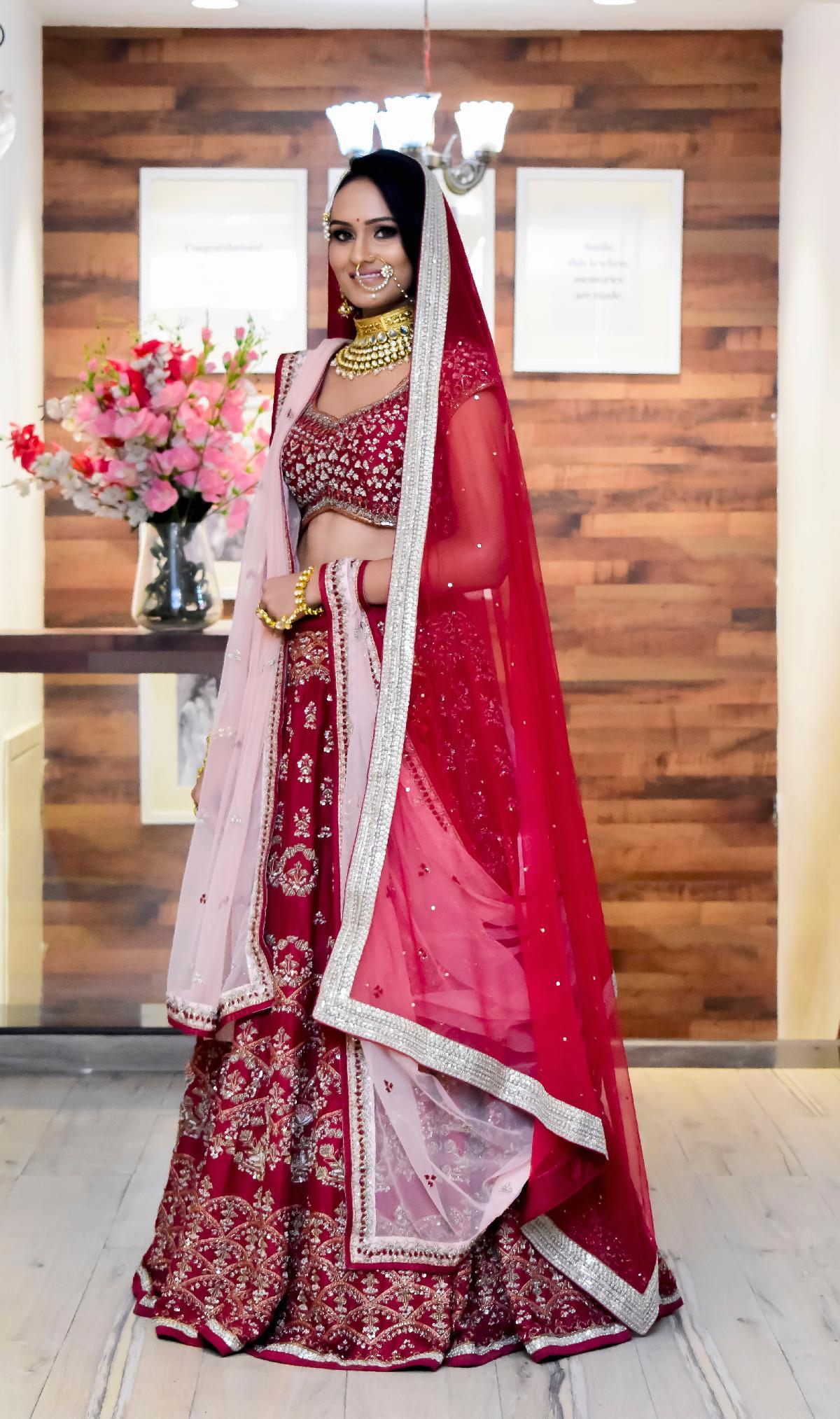 PETAL PINK LEHENGA SET WITH CONTRAST MULTI COLOURED EMBROIDERY PAIRED WITH  A MATCHING DUPATTA AND SILVER AND COLOURED EMBELLISHMENTS. - Seasons India